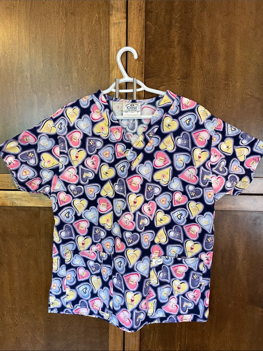 Crest Scrub Top in Navy with Pink, Yellow & Light Blue Hearts